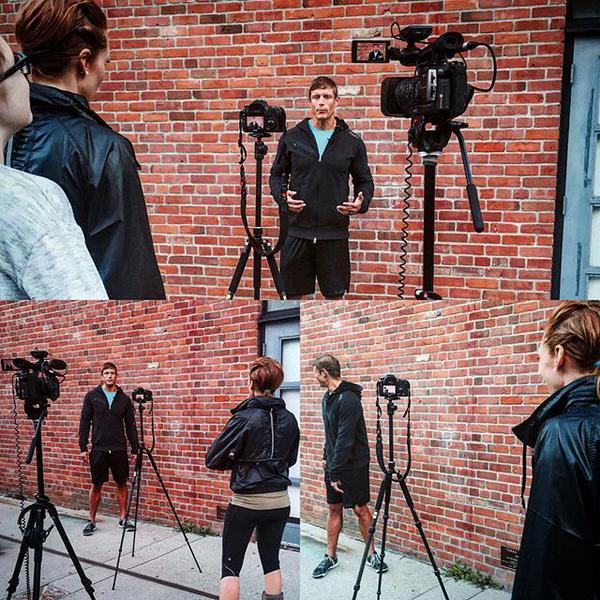 Dai Manuel being filmed and interviewed against a brick wall