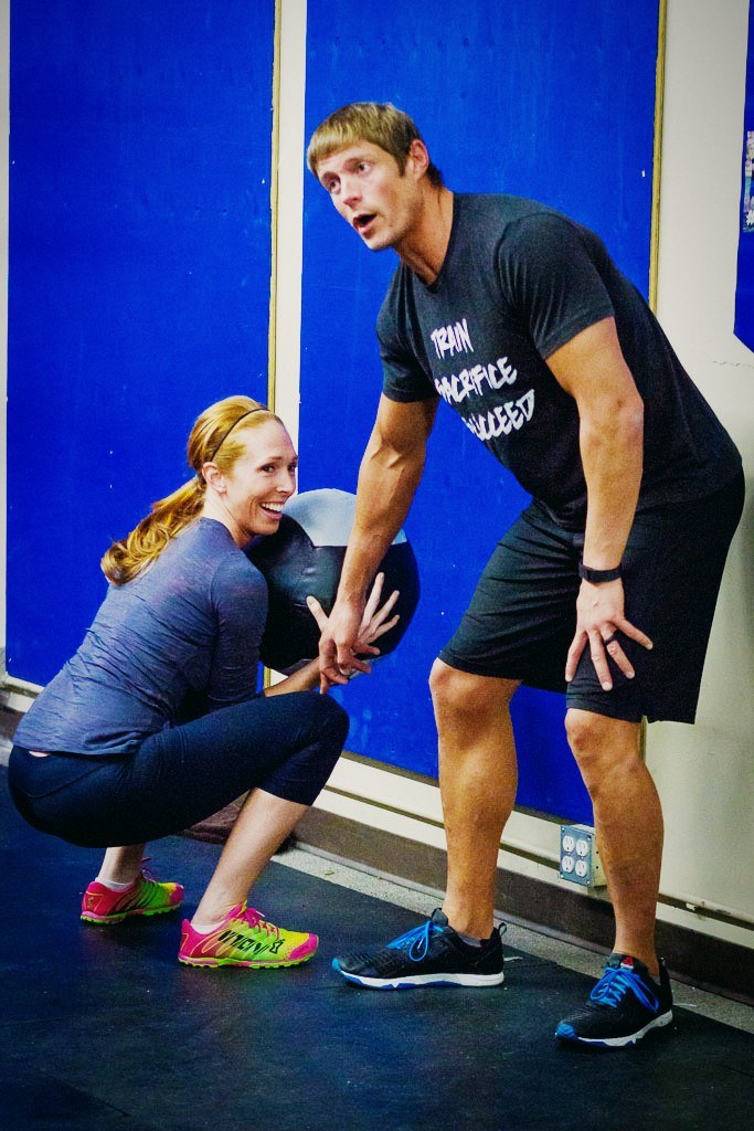 Dai Manuel coaching a member on the gym floor